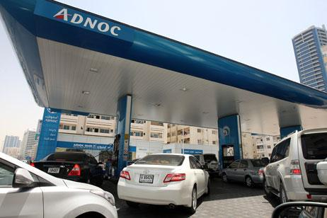 UAE commuters refueling cars during peak summer months, July 2025